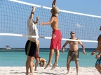 Eric (in black shorts) goes up to block the spike