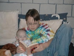 Travis teaching Nicolas to read